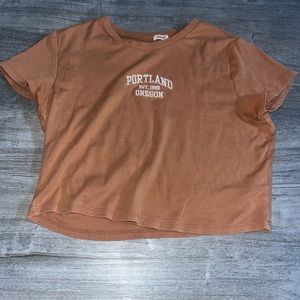 Orange cropped garage baby tee
